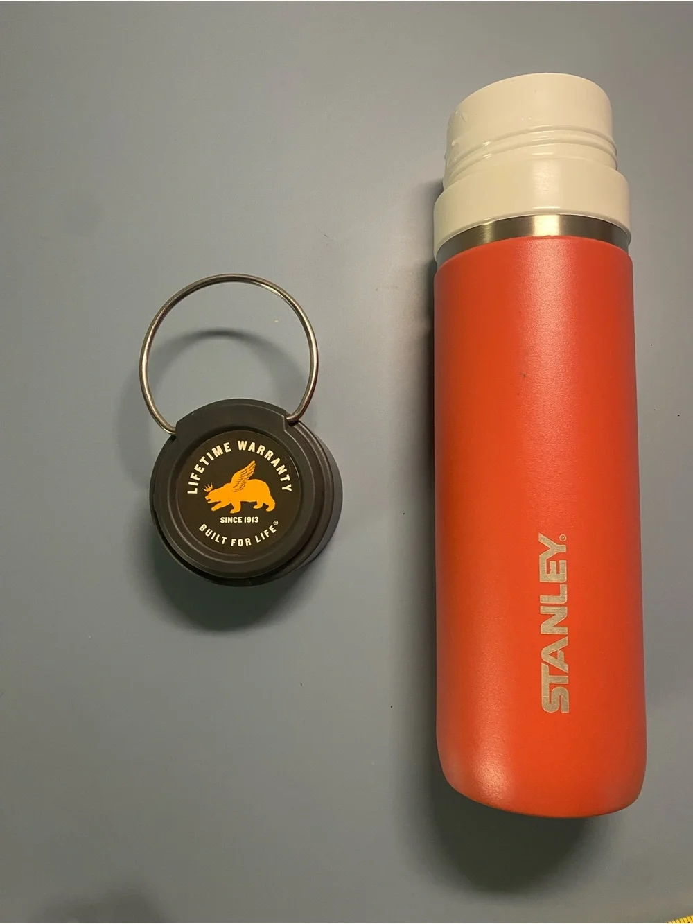 Stanley Orange Tumbler with Black Lid and White Band